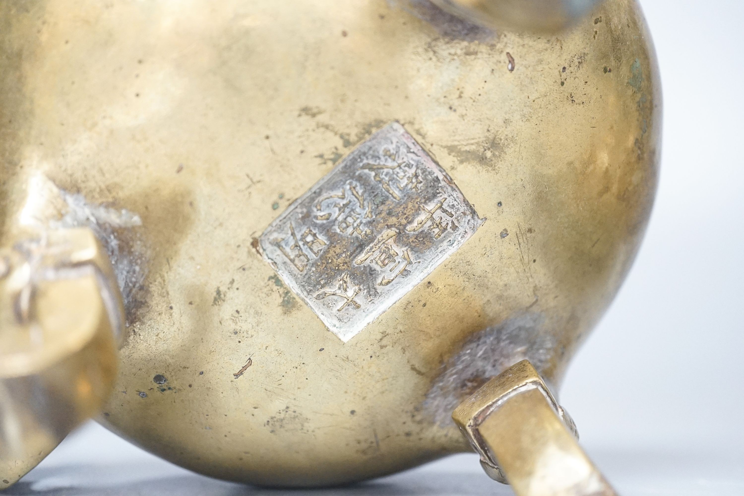 Two Chinese bronze tripod censers, Xuande marks but early 20th century, largest 21cm wide
